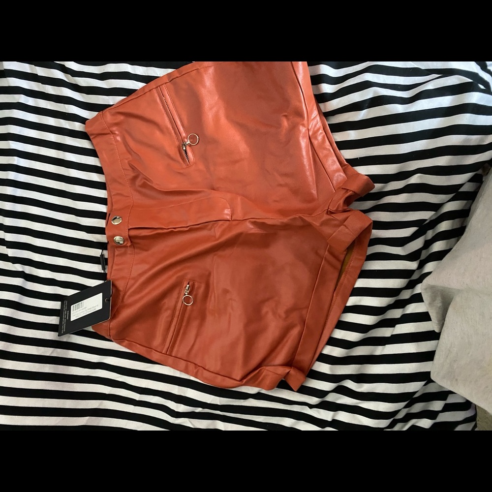 Orange leather shorts